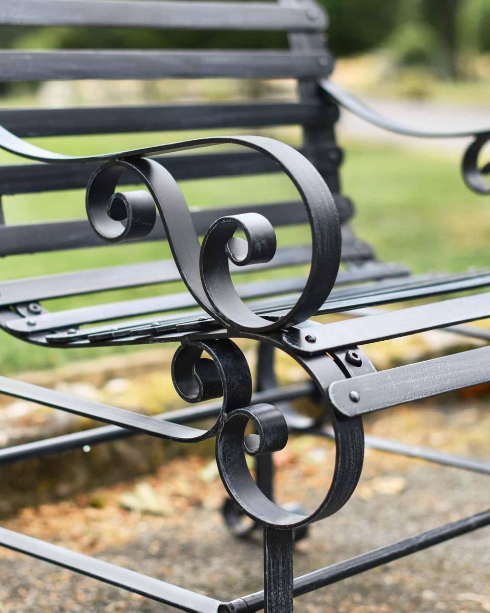 Close-Up of Ornate Armrest on Black “Chatham" One Seater Park Bench
