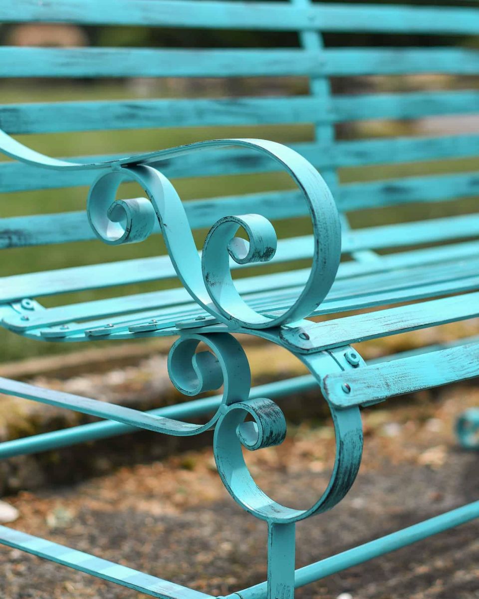 Close-Up of Ornate Armrest for Green “Chatham" Two Seater Park Bench