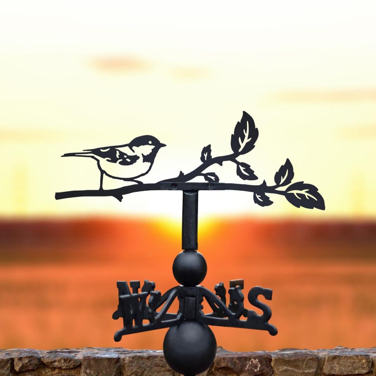 Coal tit weathervane at sunset