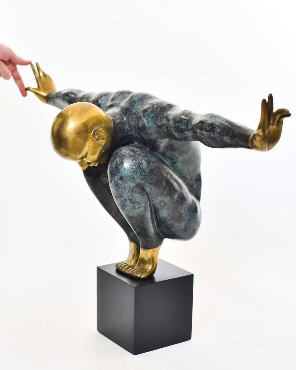 "Continuum" Cast Brass Home Sculpture with hand in shot for scale