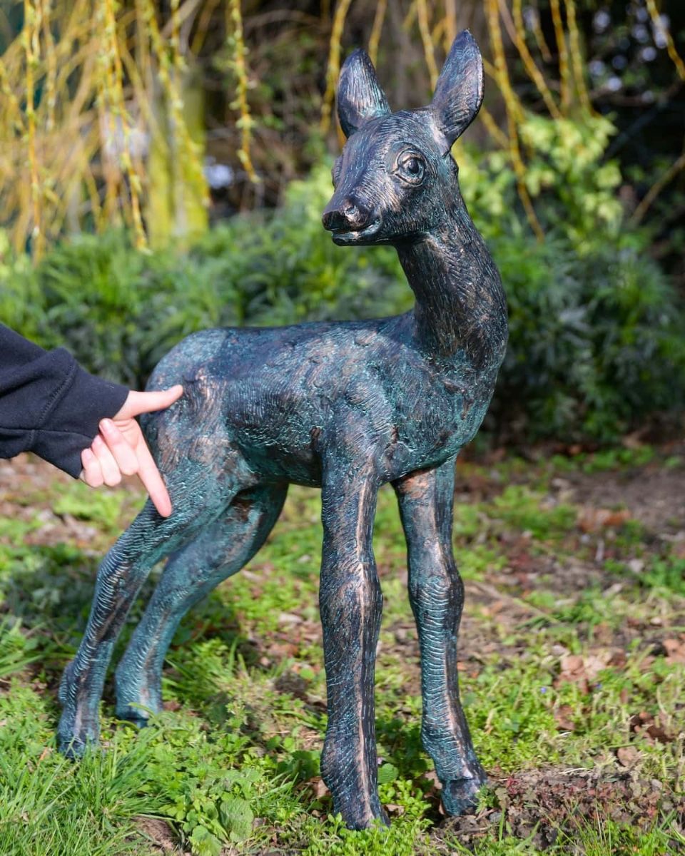 "Elowen" the Cast Aluminium Fawn Garden Sculpture in a Verdigris Finish with Hand in Shot for Scale