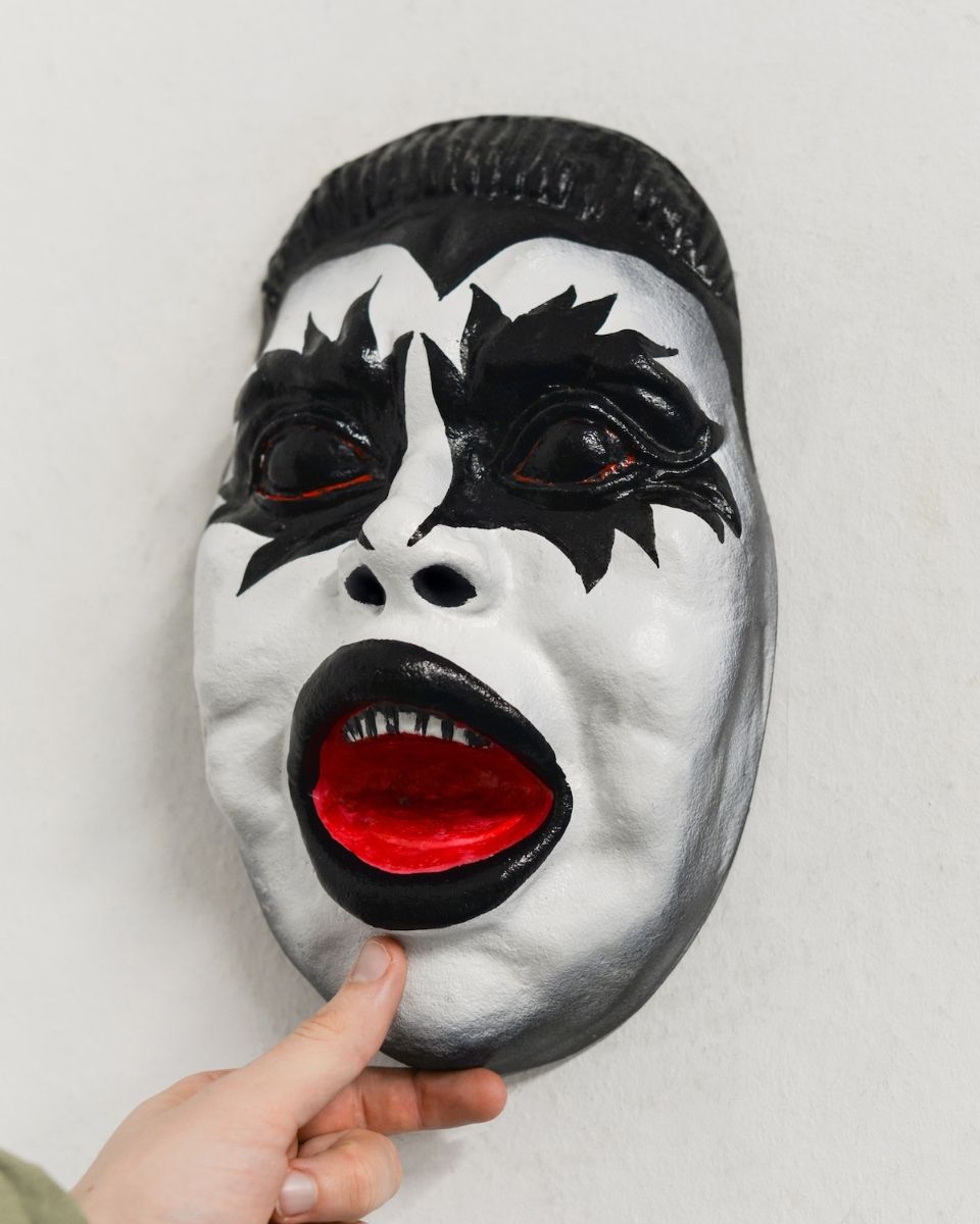 "Encore" Face Modern Cast Aluminium Wall Art with hand in shot for scale