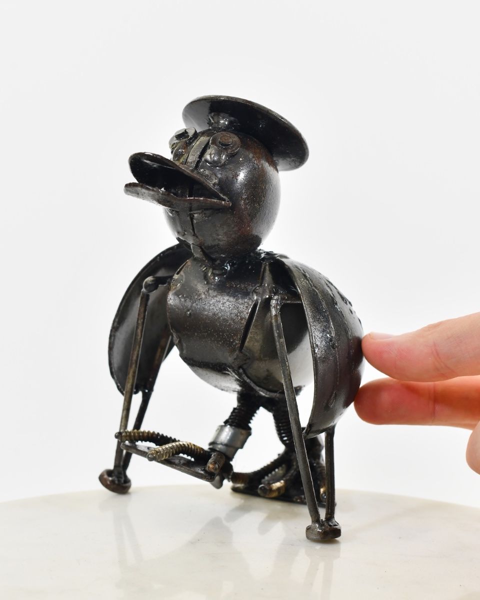 "Flap" Injured Duck Scrap Metal Sculpture hand in shot for scale