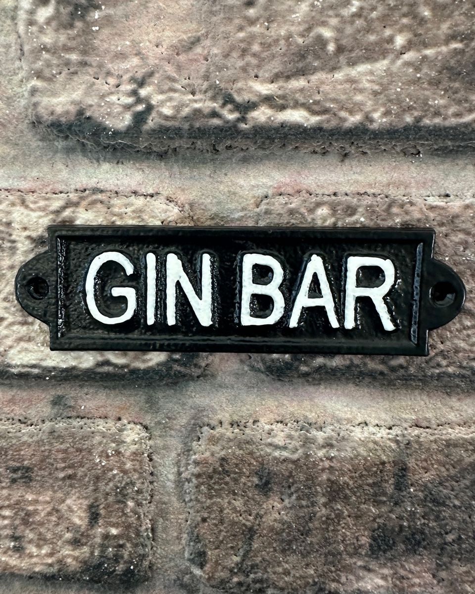 "Gin Bar" Traditional Cast Iron Wall Sign mounted on a brick wall