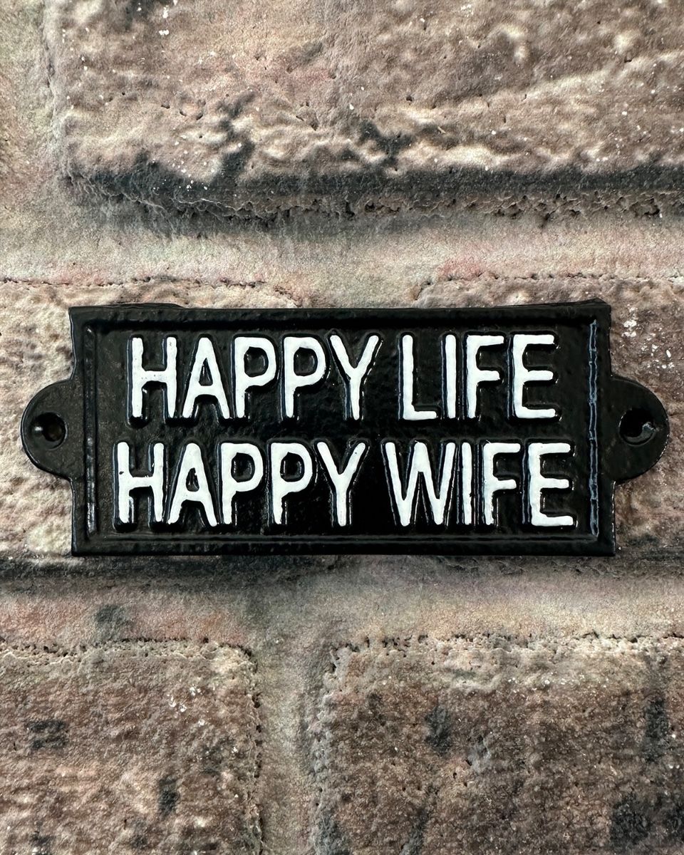 "Happy Life Happy Wife" Traditional Cast Iron Wall Sign mounted on a brick wall