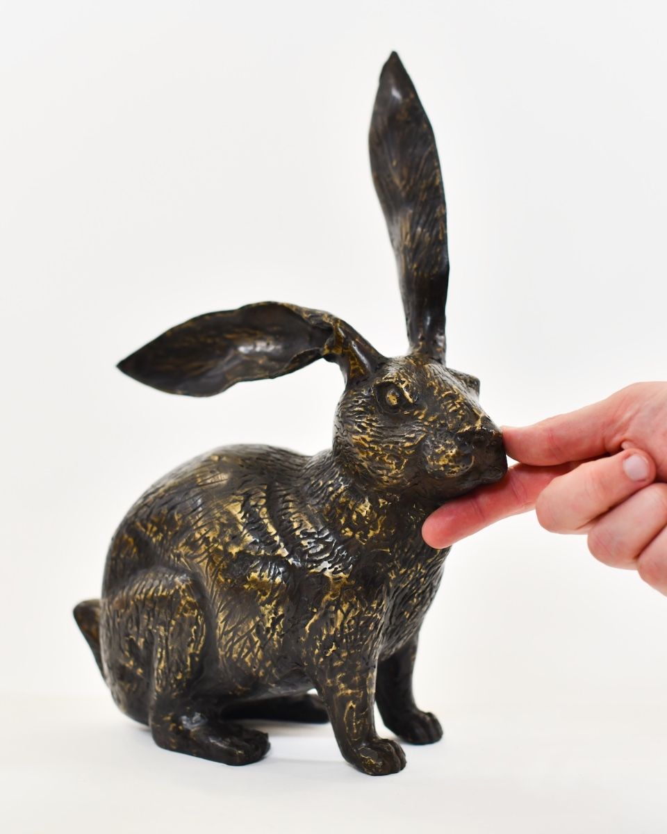 "Heathland Herald" Cast Brass Alert Hare Sculpture with hand in shot for scale