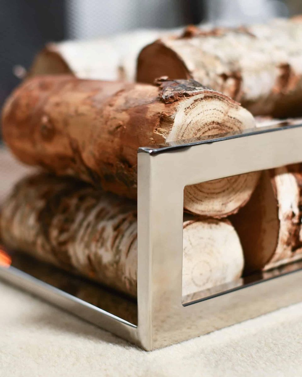 Close-Up of “Hinburn House” Contemporary Stainless Steel Log Store with Logs