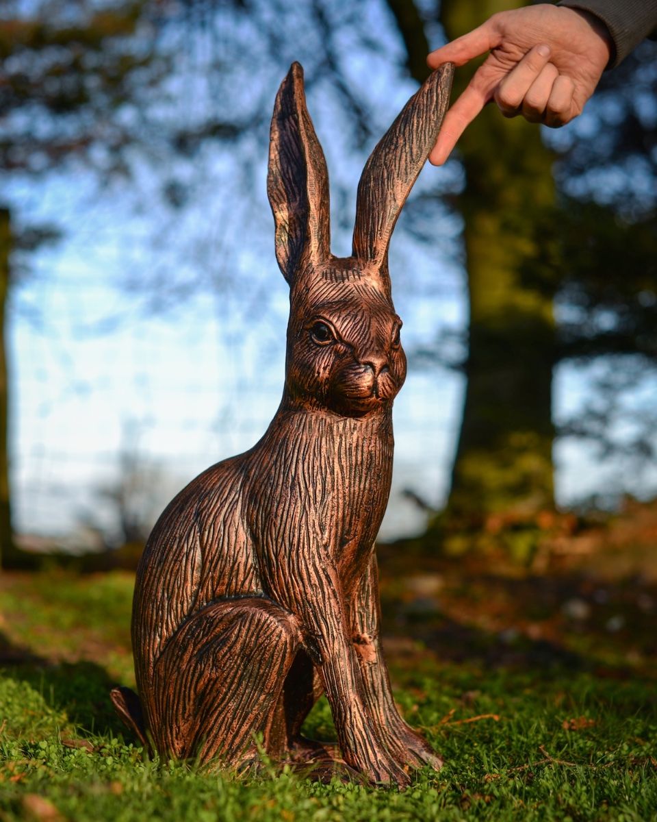 "Hunter" the Hare Cast Aluminium Garden Sculpture - Bronze and Copper with hand in shot for scale