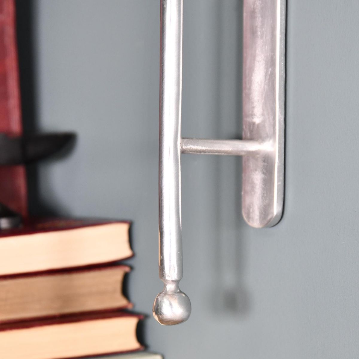 Close-up of the Modern Design on the ’Kepler’ Polished Aluminium Wall Bracket 