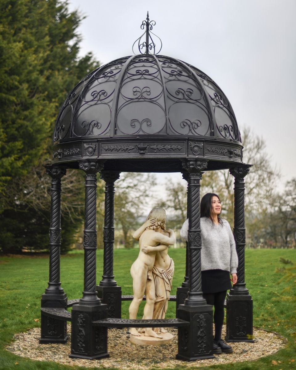 "Lady Christina" Deluxe Scrollwork Wrought Iron Gazebo Powder Coated in Midnight Black scale image with lady stood under gazebo