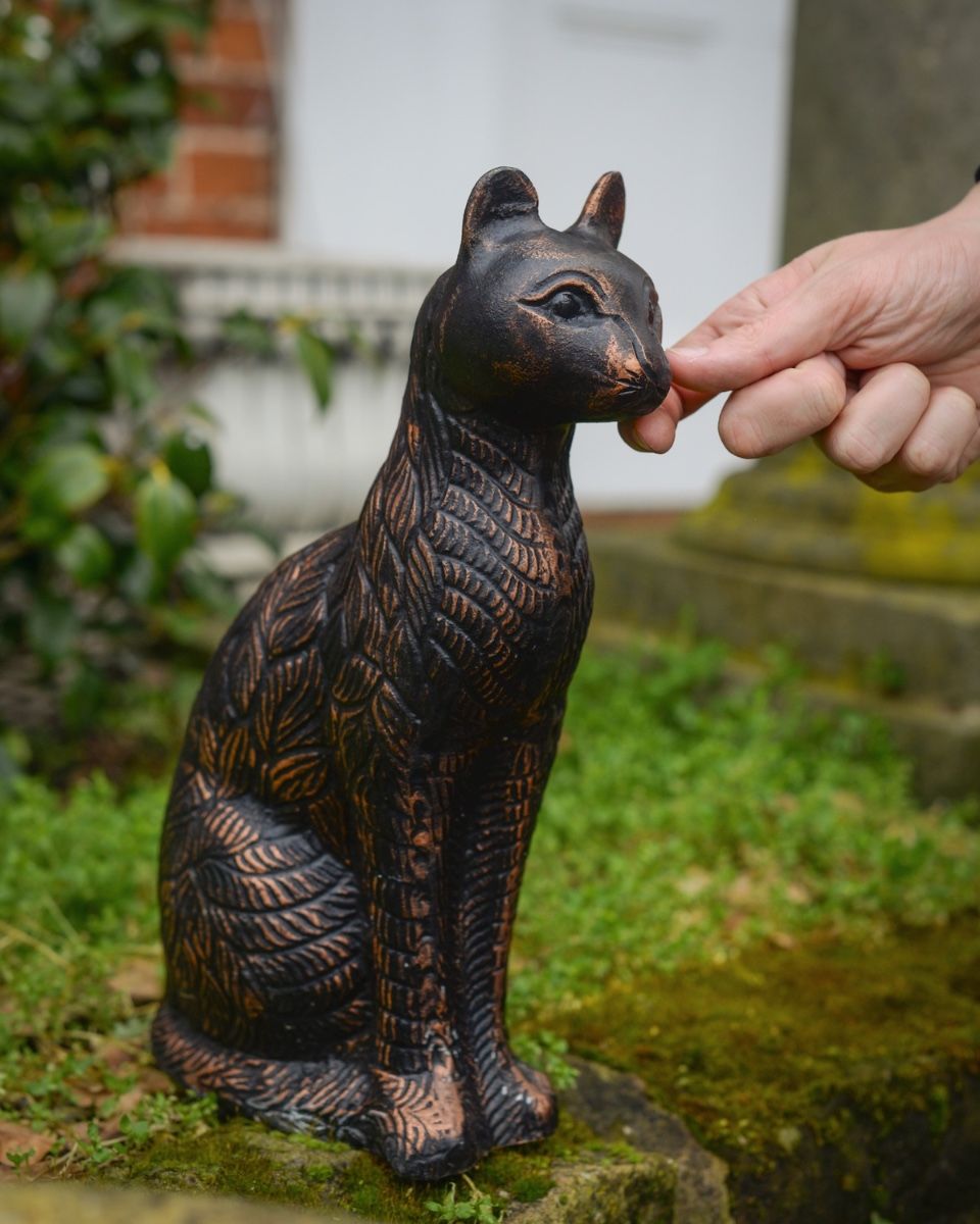 "Luna" the Sitting Cat Cast Aluminium Garden Sculpture with hand in shot for scale