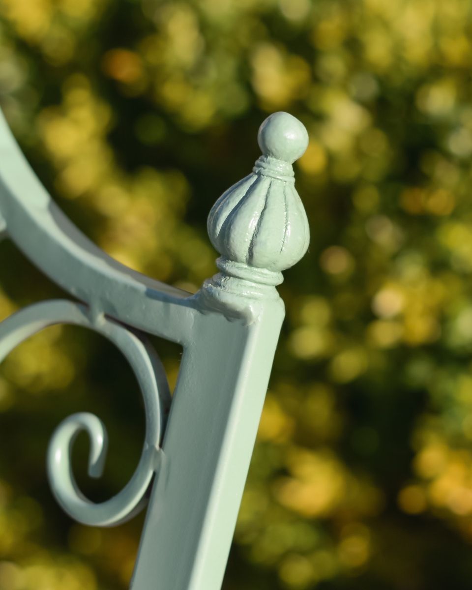 "Lyceum" Garden Rocking Bench Wrought Iron - Sage close up of finial