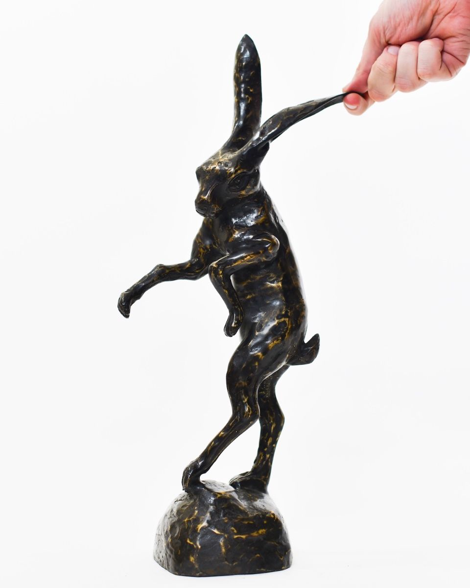 "March Meadow Hare" Cast brass Hare Sculpture with hand in shot for scale