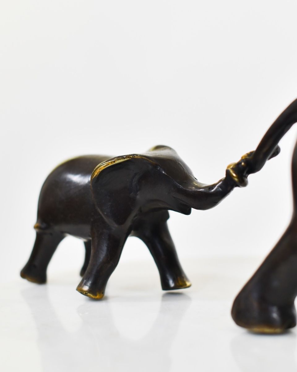 "Matriarch"s Guidance" Cast Brass Elephant Ornament close up of child