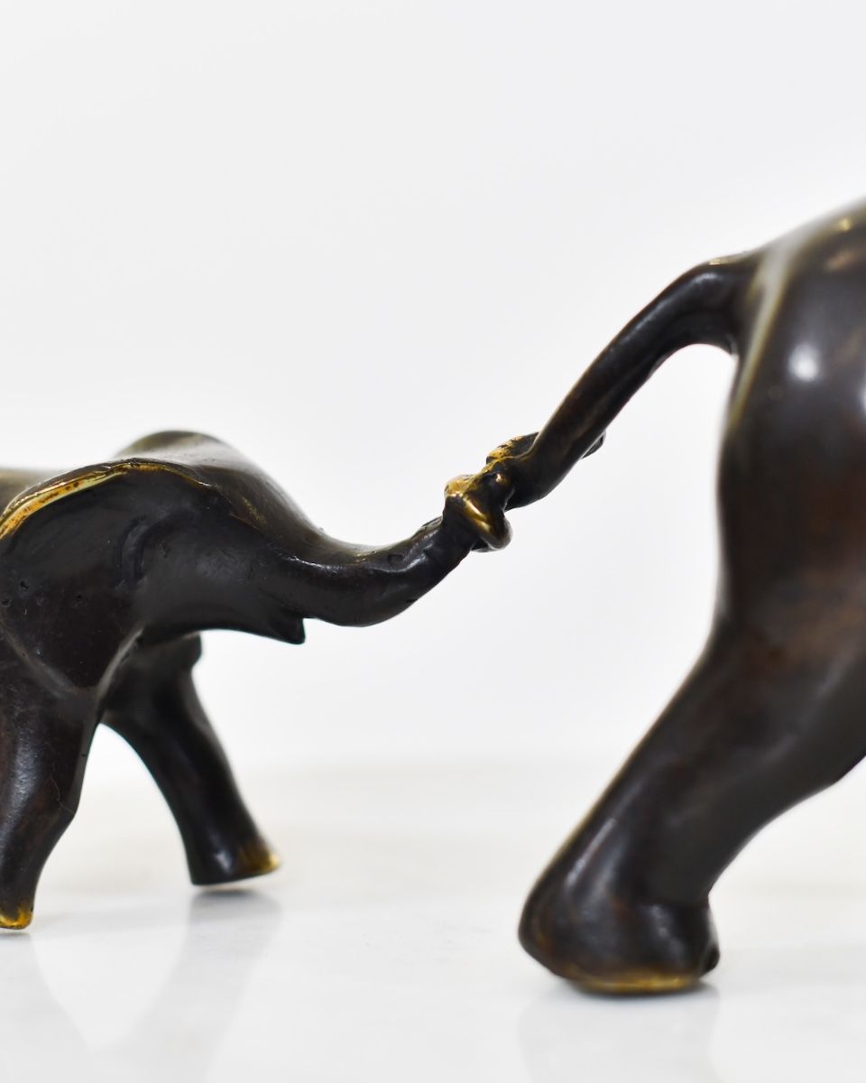 "Matriarch"s Guidance" Cast Brass Elephant Ornament trunk gripping tail of mother