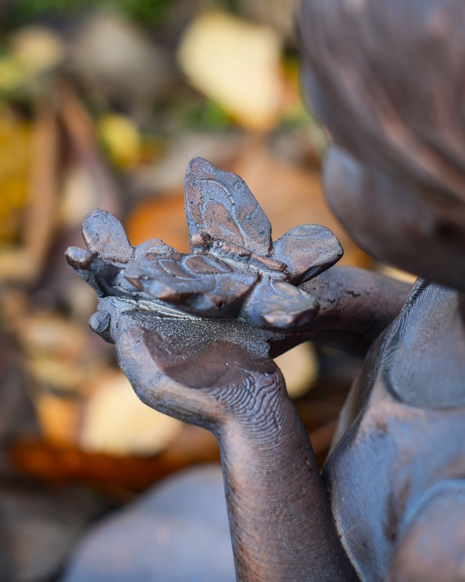"Meadow"s Offering" Girl Holding Butterfly Resin Garden Sculpture close up of butterfly