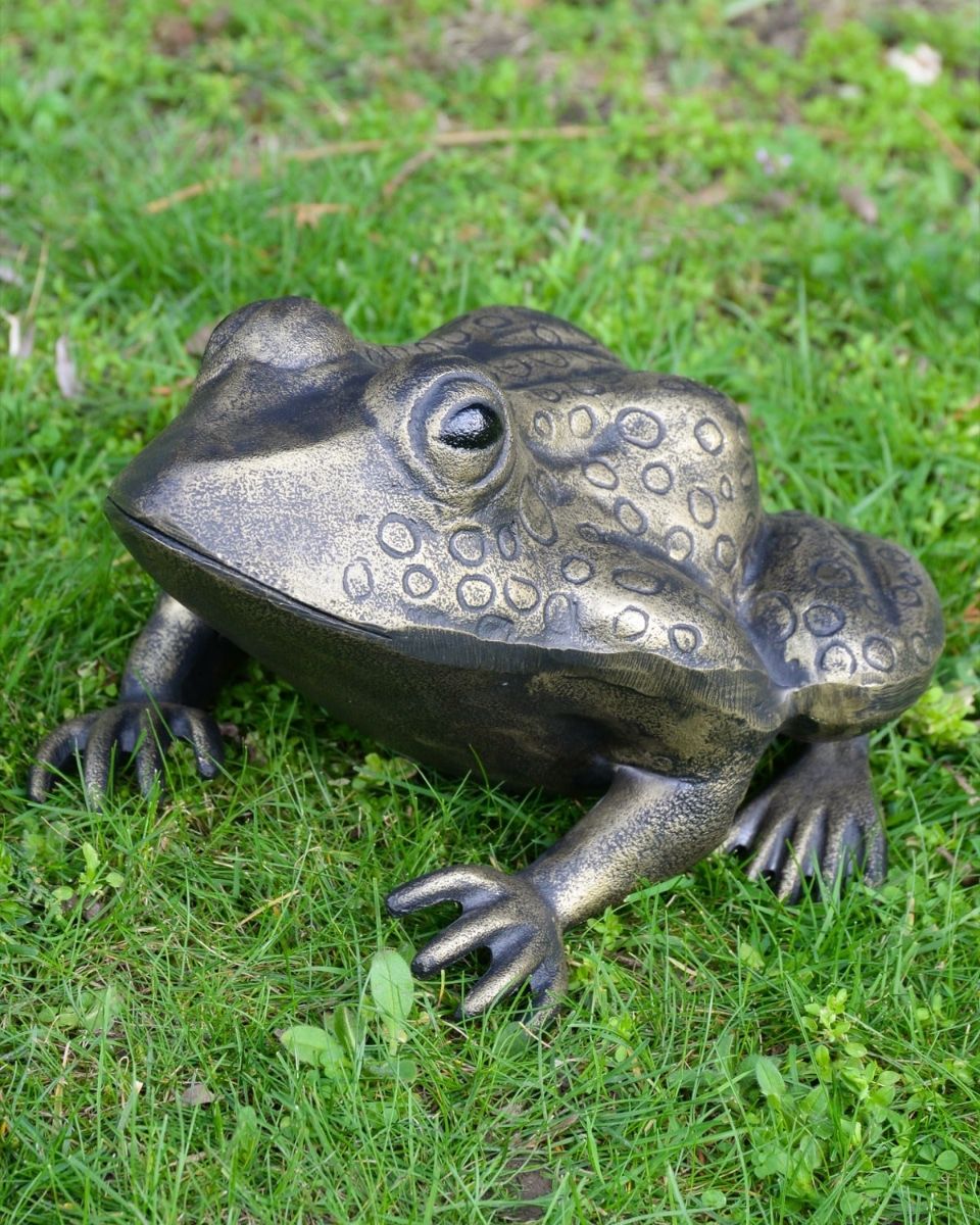 Gold Version of the "Morty" the Toad Cast Aluminium Garden Sculpture Positioned on a Lawn