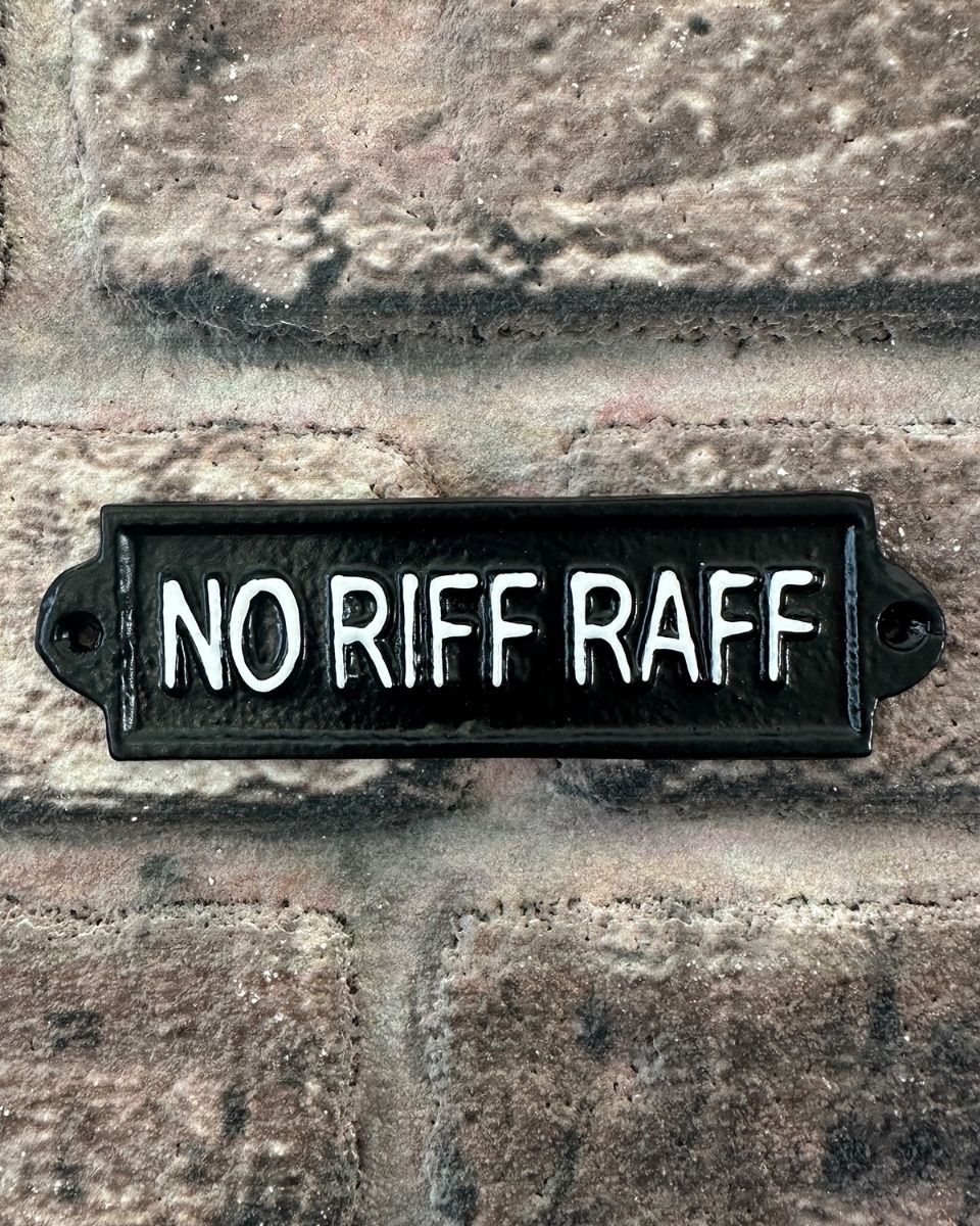 "No Riff Raff" Traditional Cast Iron Wall Sign mounted on a brick wall