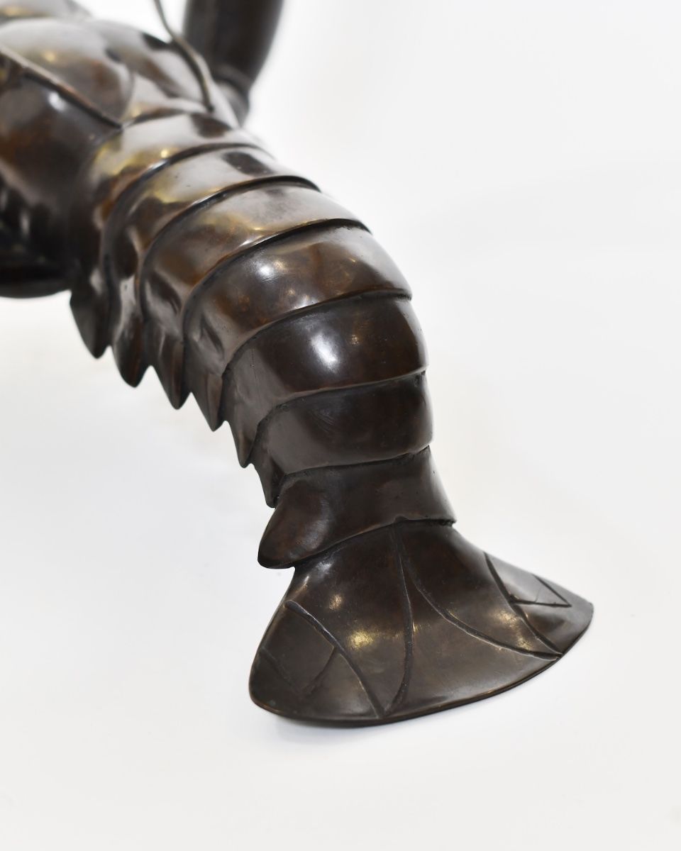 "Obsidian Tide" Lobster sculpture in Cast Brass close up of tail
