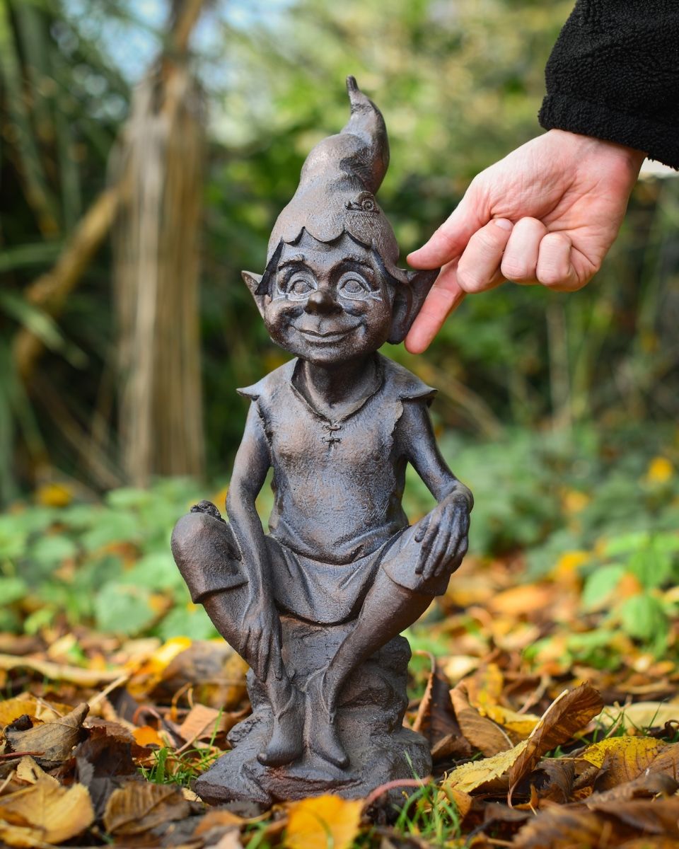 "Perched Pixie" Resin Garden Sculpture Bronze and Verdigris with hand in shot for scale