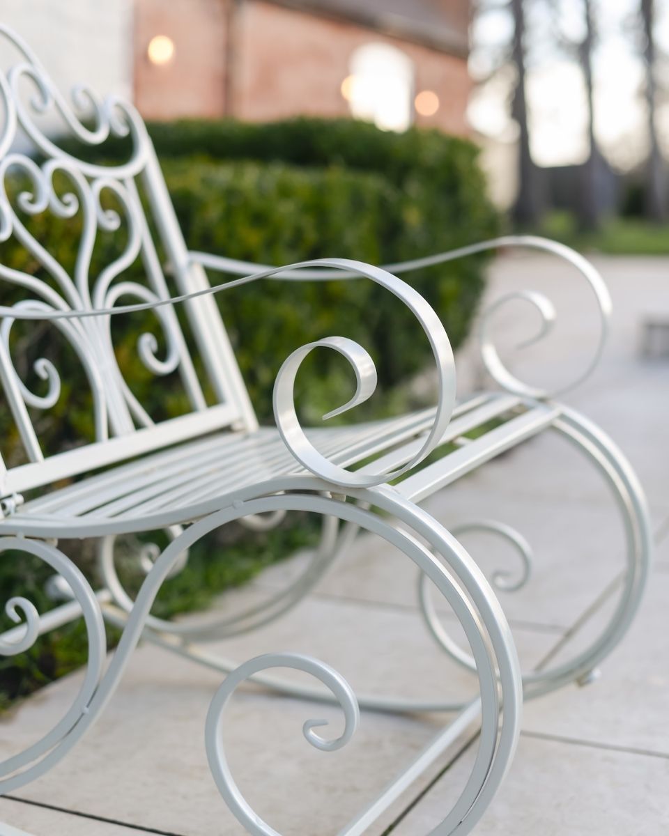 "Province" Wrought Iron Cream Garden Rocking Chair close up of legs