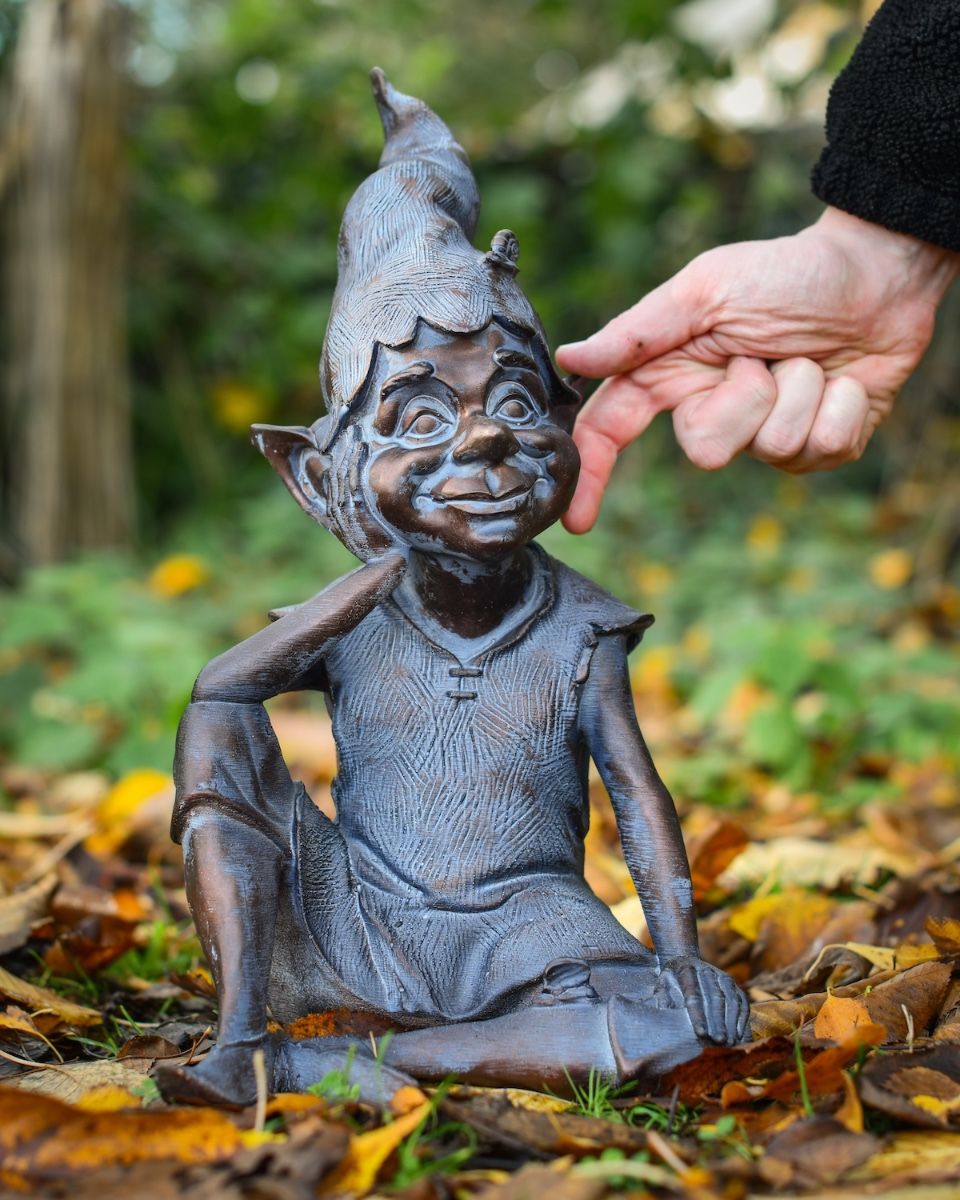"Reminiscing Pixie" Resin Garden Sculpture Bronze and Verdigris with hand in shot for scale