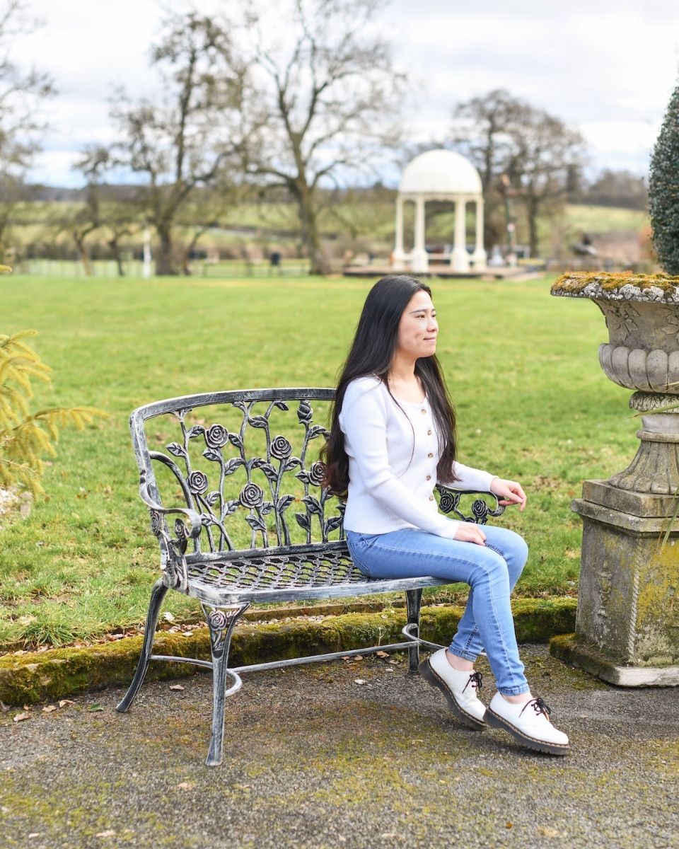 "Rosetta" Black & Silver Rose Design Bench with lady sat on bench