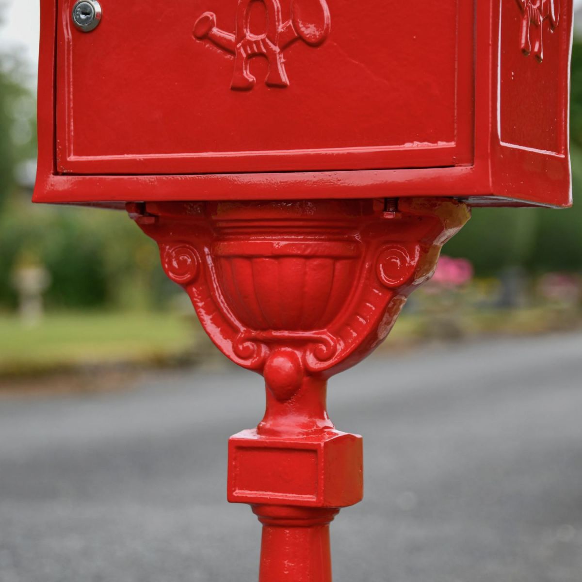 Close-Up of Detailing on “Saffron Blossom” Red Suffolk Post Box with Stand