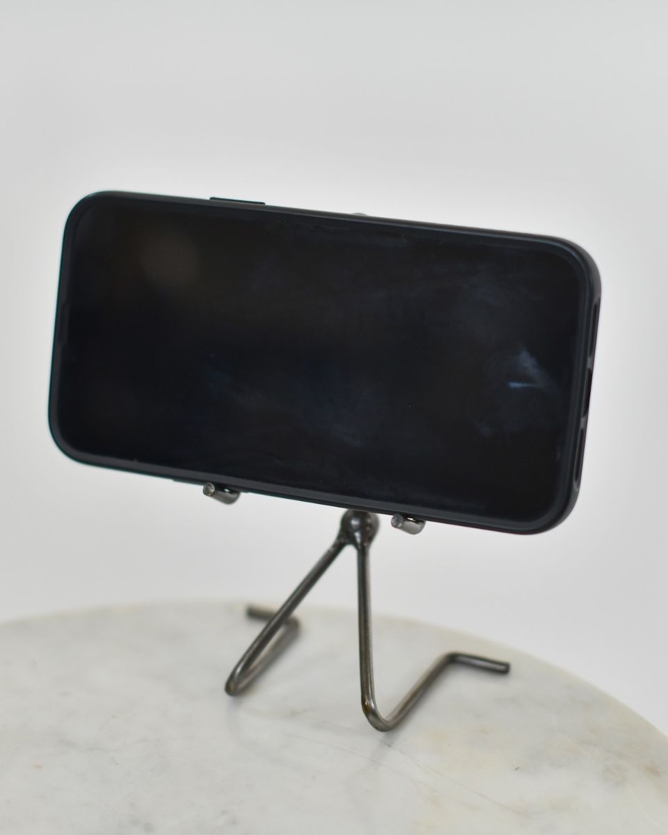 "Score" Celebration Upcycled Metal Phone Holder holding phone from the front