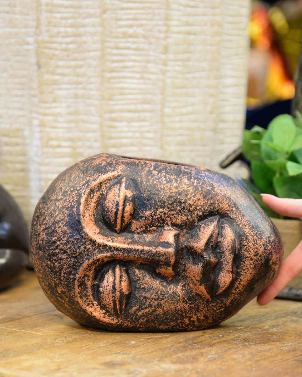 ‘Sleeping Guardian’ Contemporary Tribal Planter in Cast Aluminium small planter with hand in shot for scale