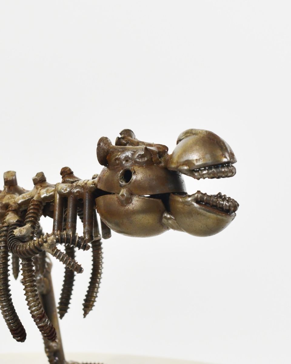"Snap" Upcycled Metal T-Rex Ornament close up of head
