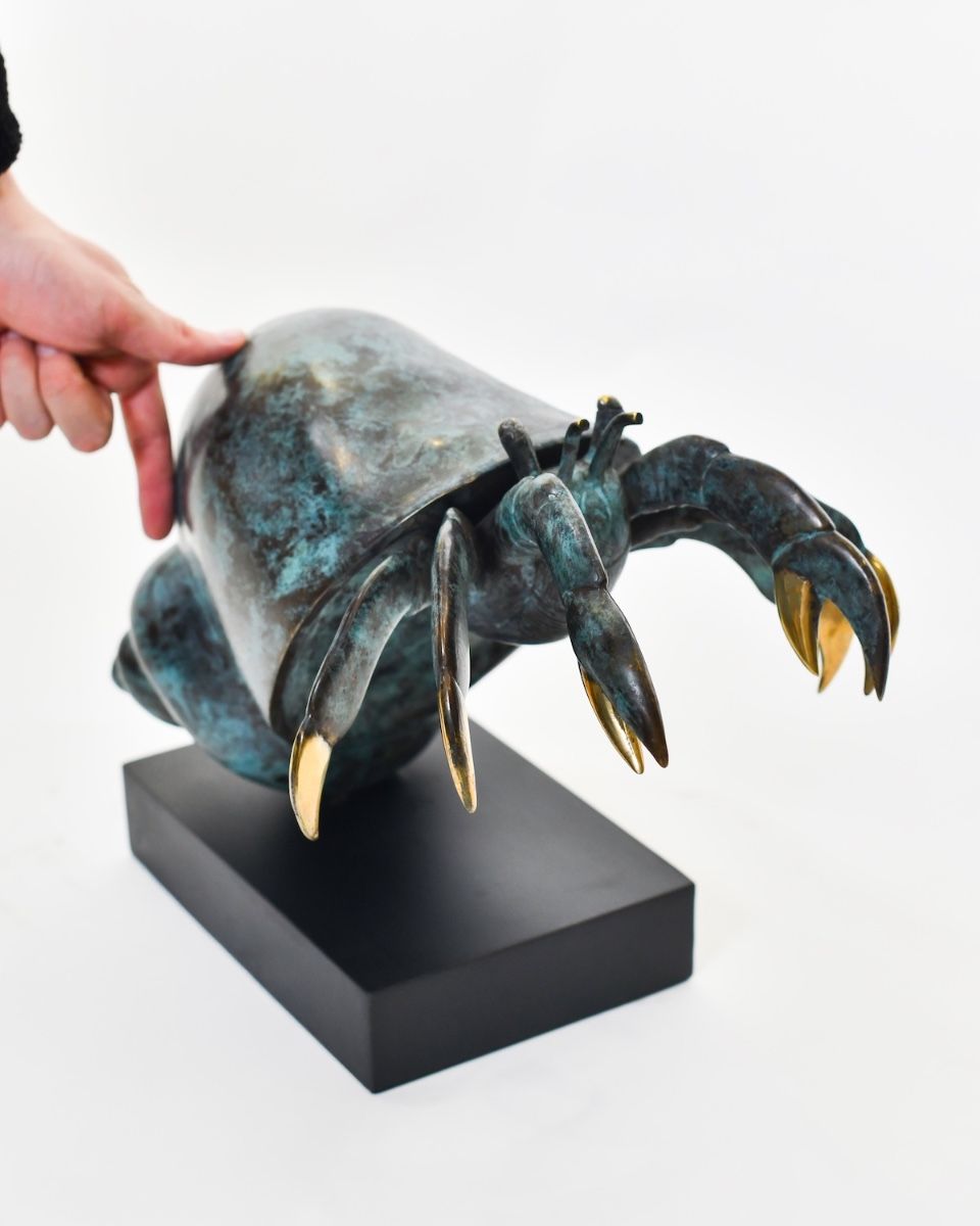"Sovereign of the Shell" Hermit Crab Sculpture in Cast Brass with hand in shot for scale