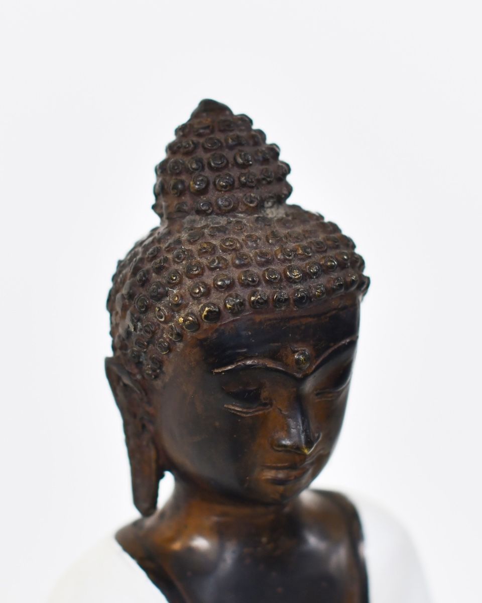 "Stillness Spoken" Cast Brass Buddha Ornament close up of top of head