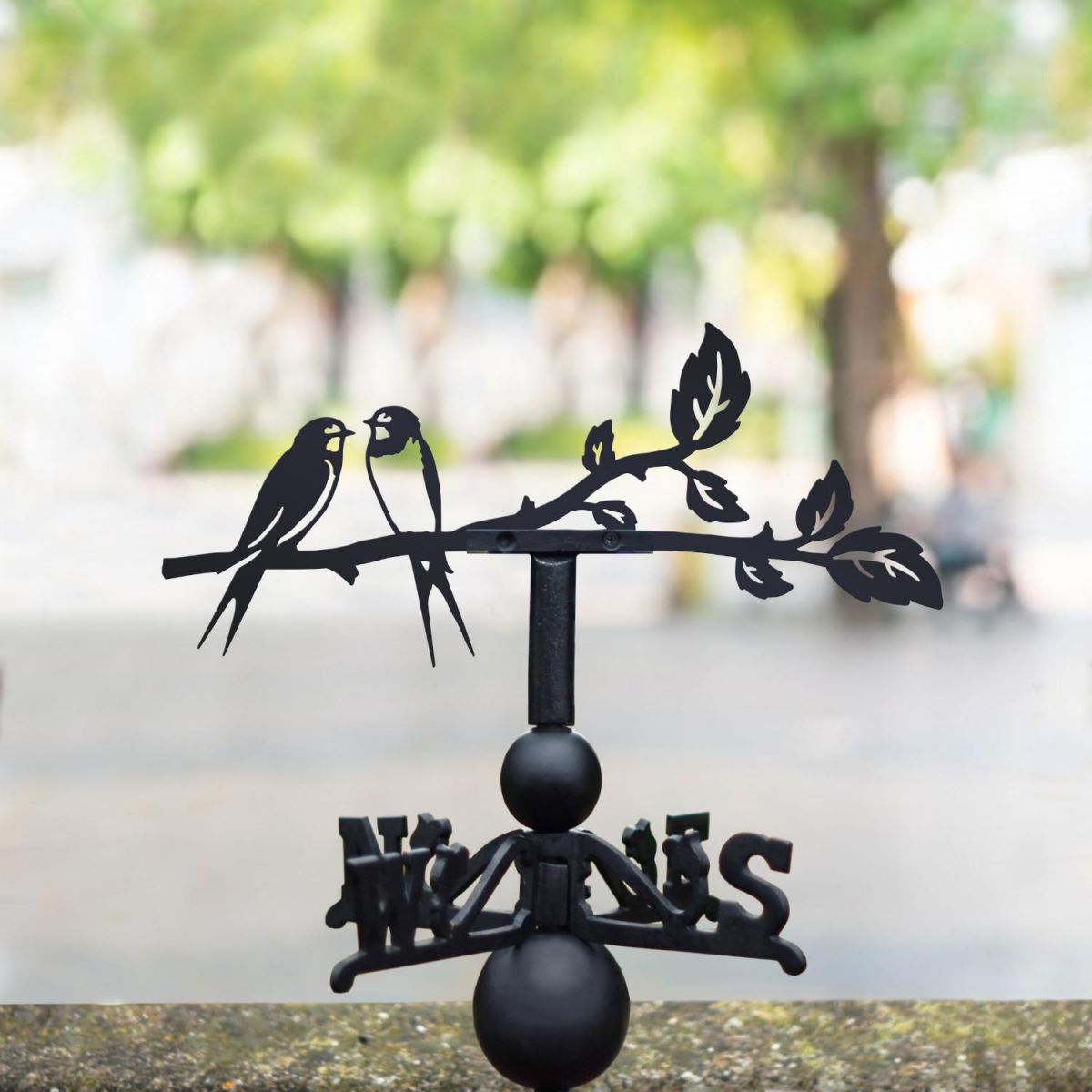 Swallow weathervane located in the park