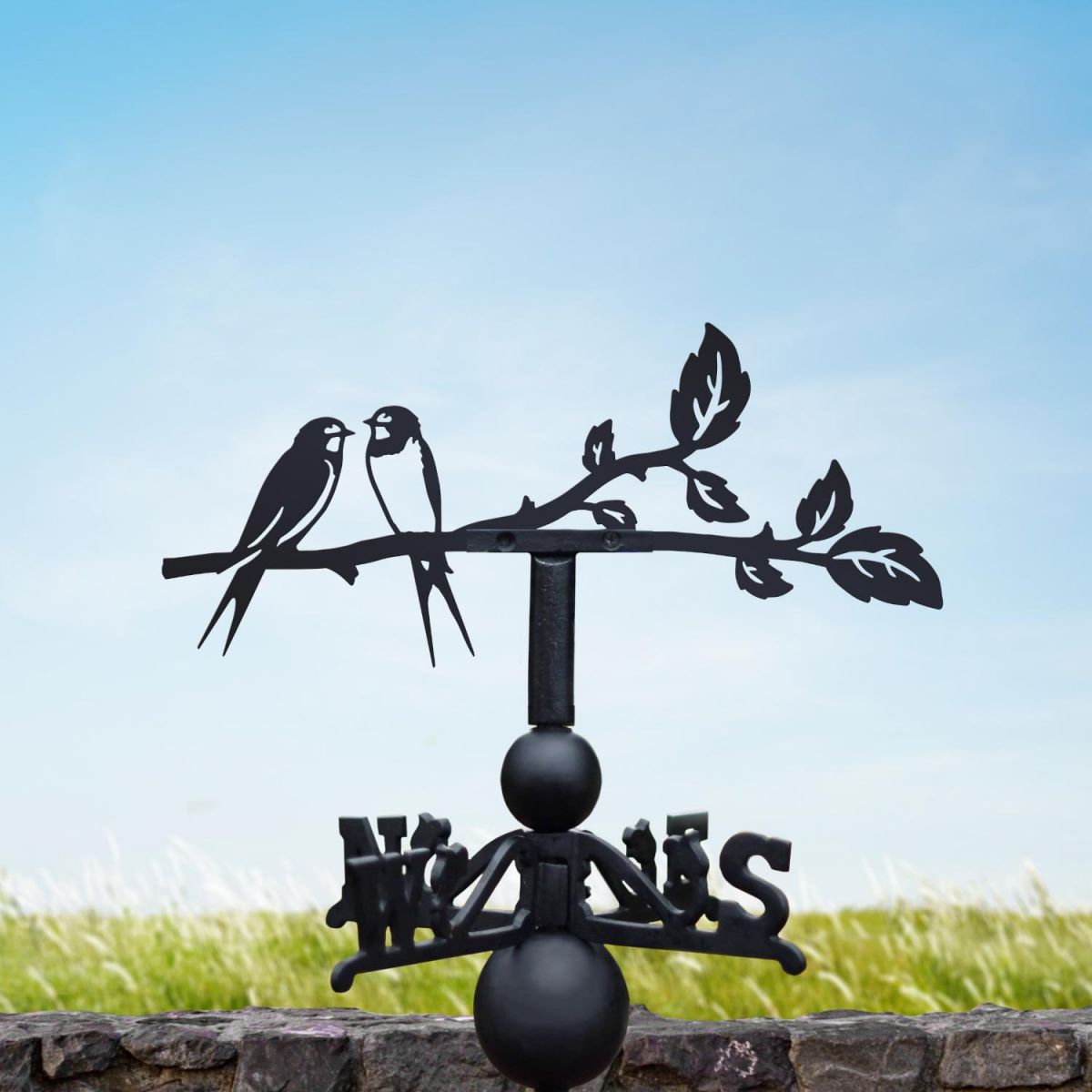 Swallow weathervane on a sunny day