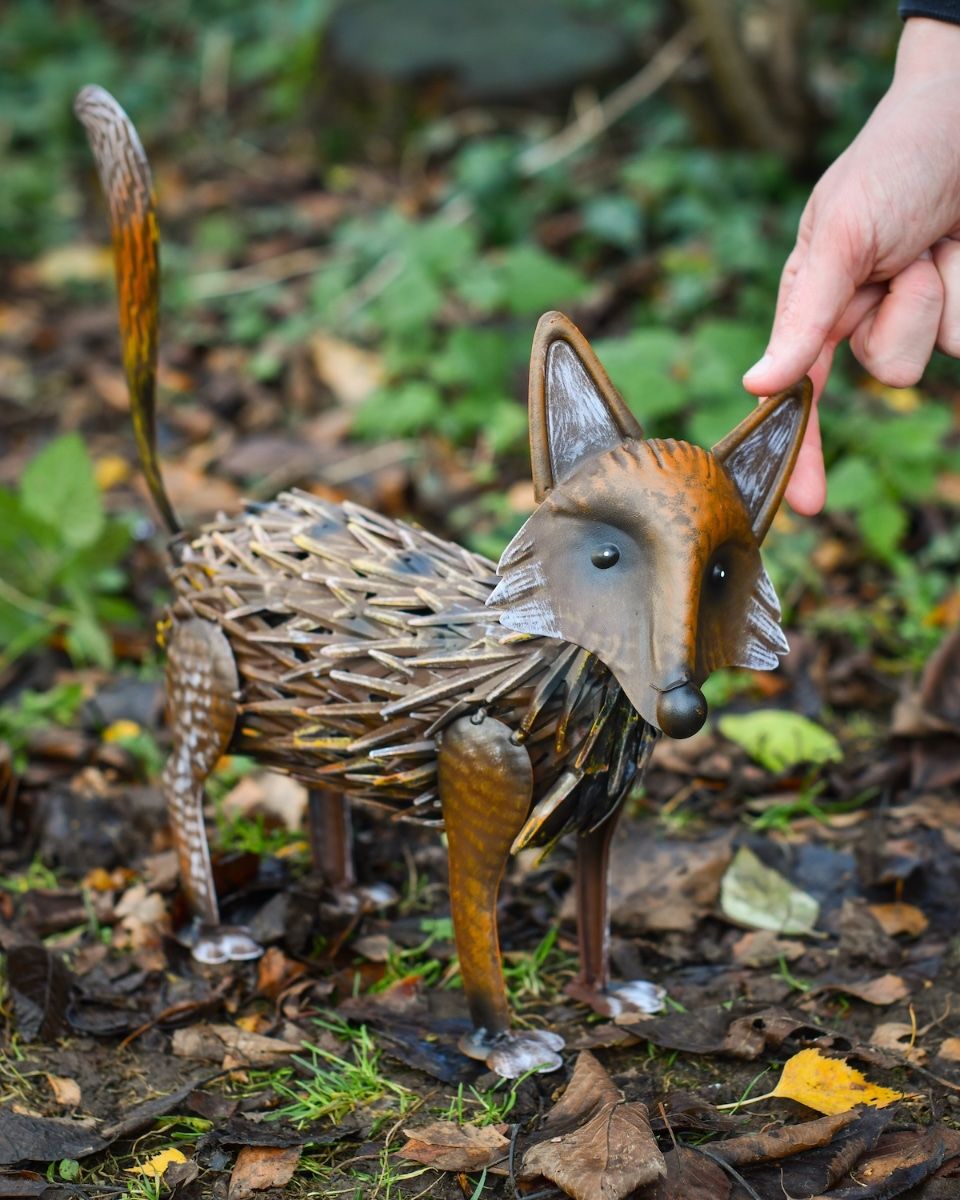 "Thatch" Steel Fox Garden Sculpture with hand in shot for scale