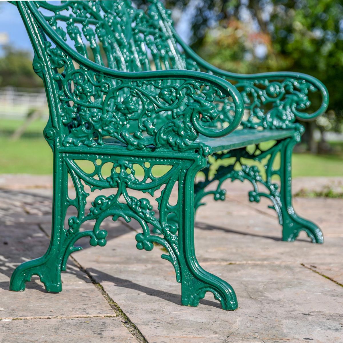 Close-up of the Ornate Arms on the Green Cast Iron Gothic Garden Bench 