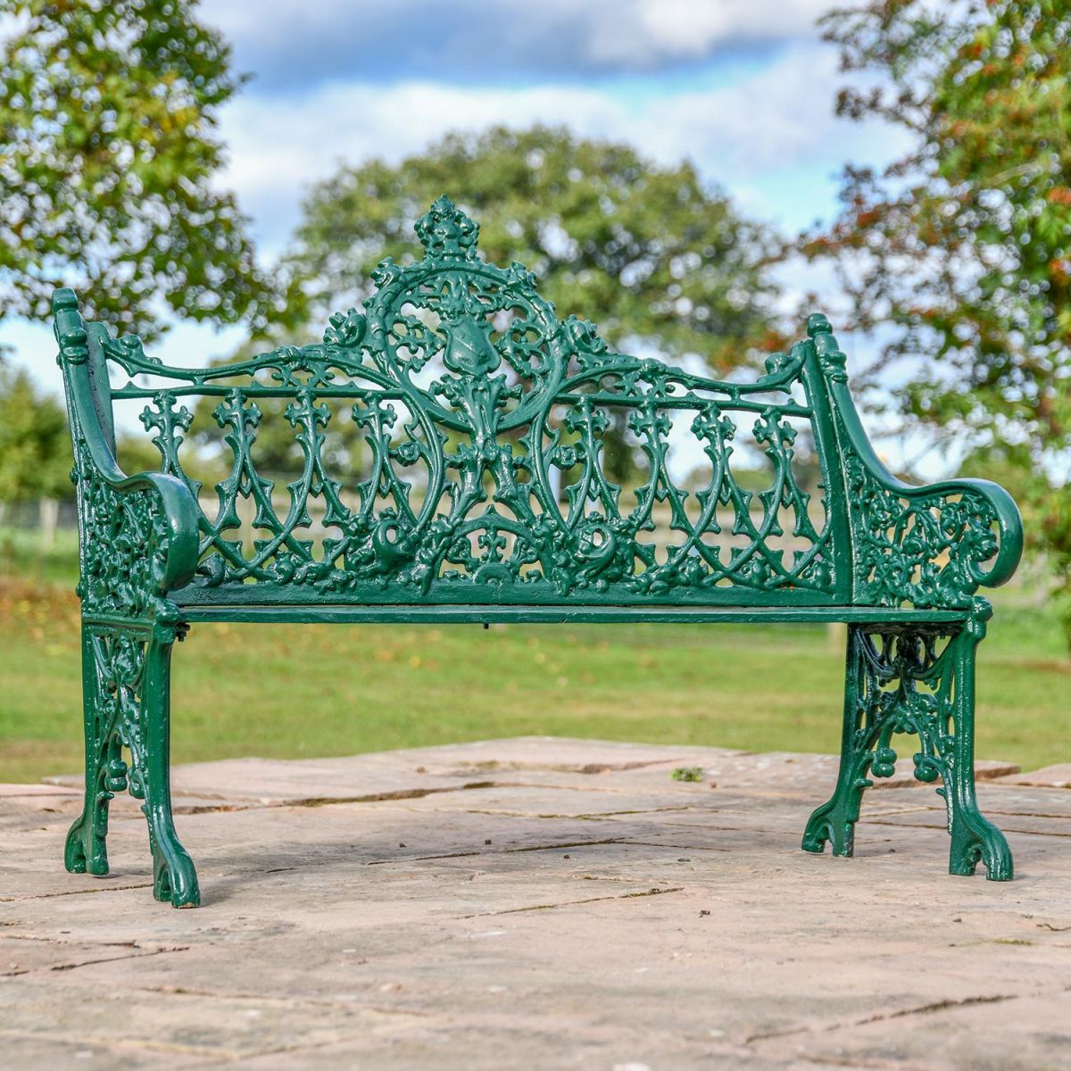 Green Cast Iron Gothic Garden Bench in Use in the garden