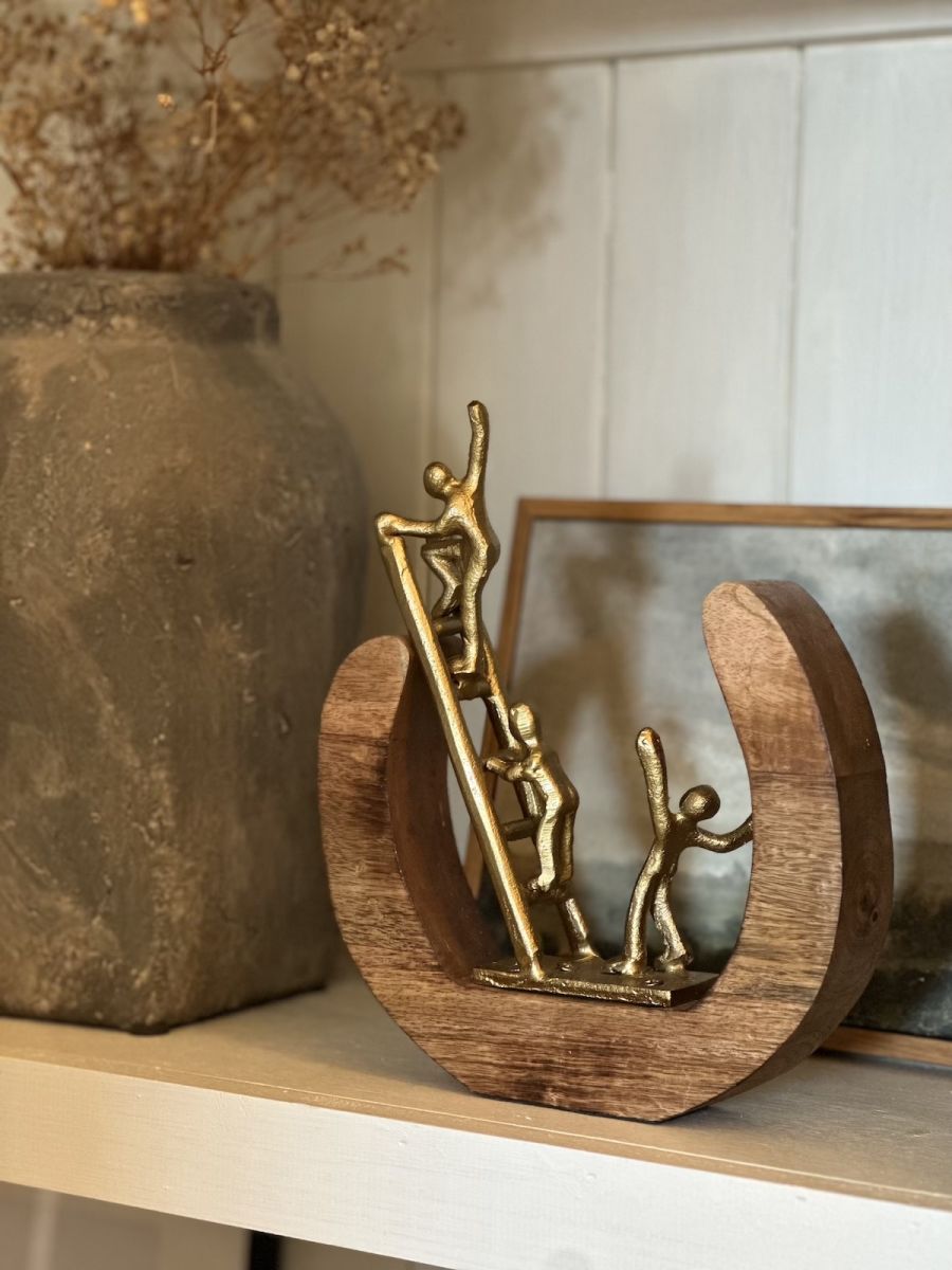 In situ photo of gold figure interior ornament In situ photo of gold figure interior ornament