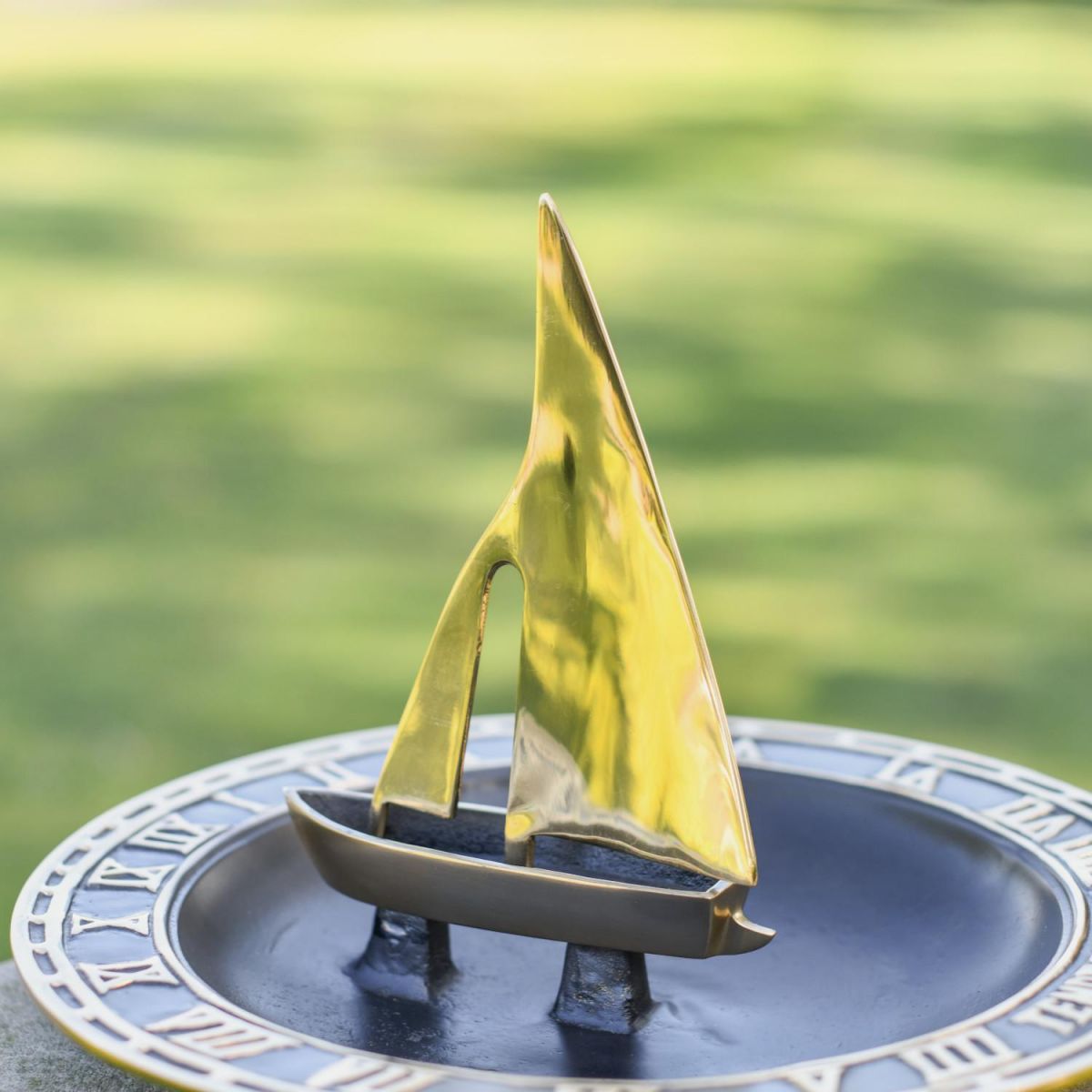 Close-Up of "Trade Winds" Sailboat Bird Bath and Sundial - 300mm
