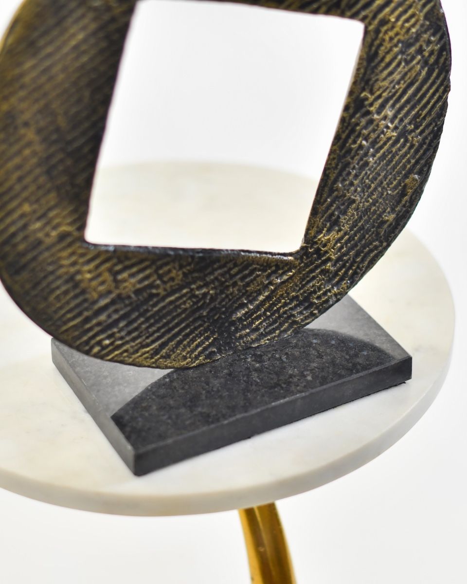 "Triple Aspect" Cast Aluminium Home Ornament - Black and Gold close up of base