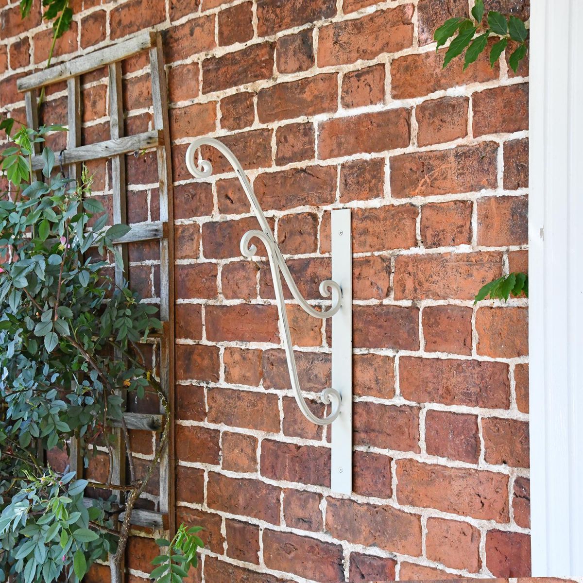 "Turenne" Rustic Cream Hanging Basket Bracket on the Front of a House