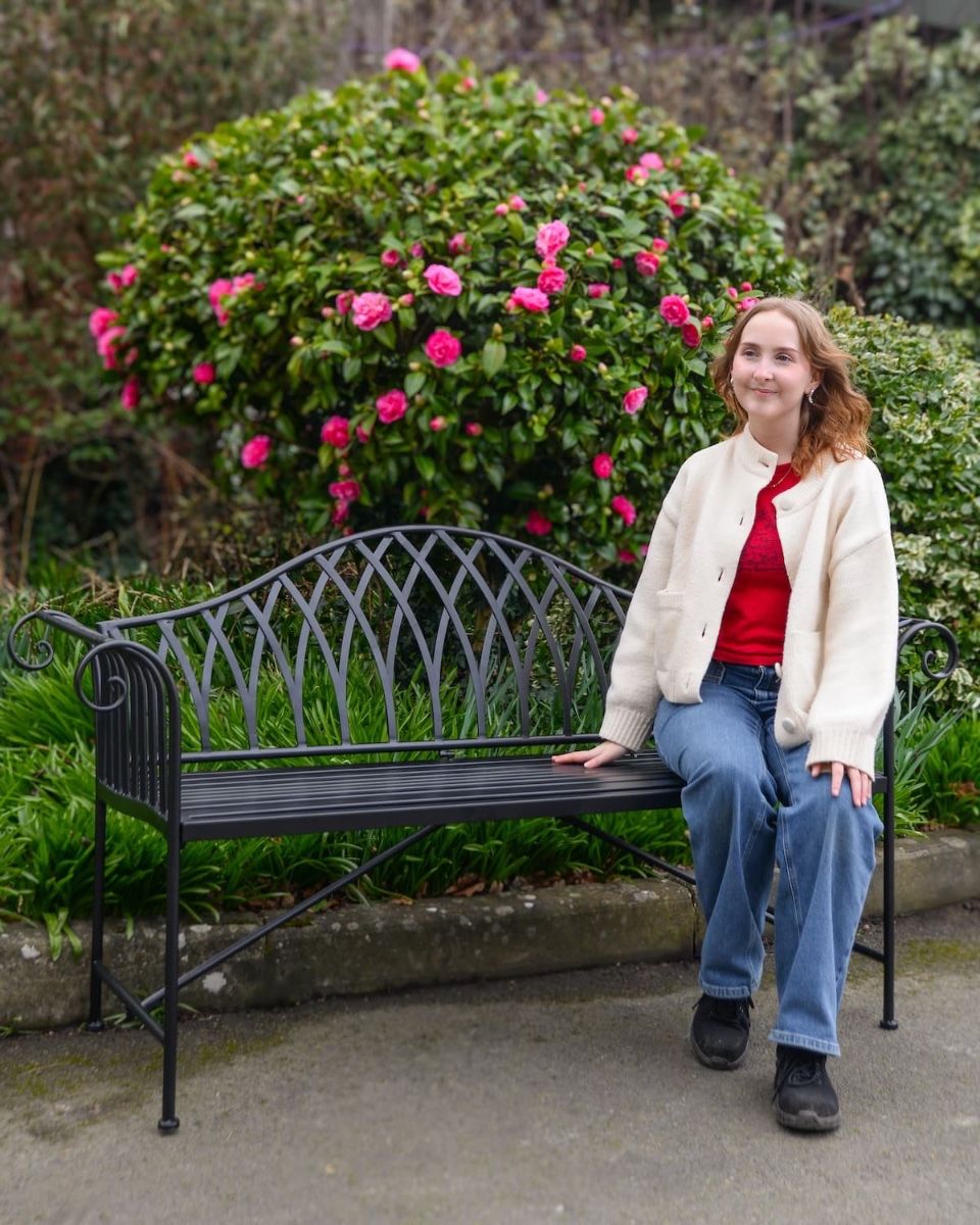 "Twilight" Wrought Iron Arched Garden Bench with Lady Sat on Bench for Scale