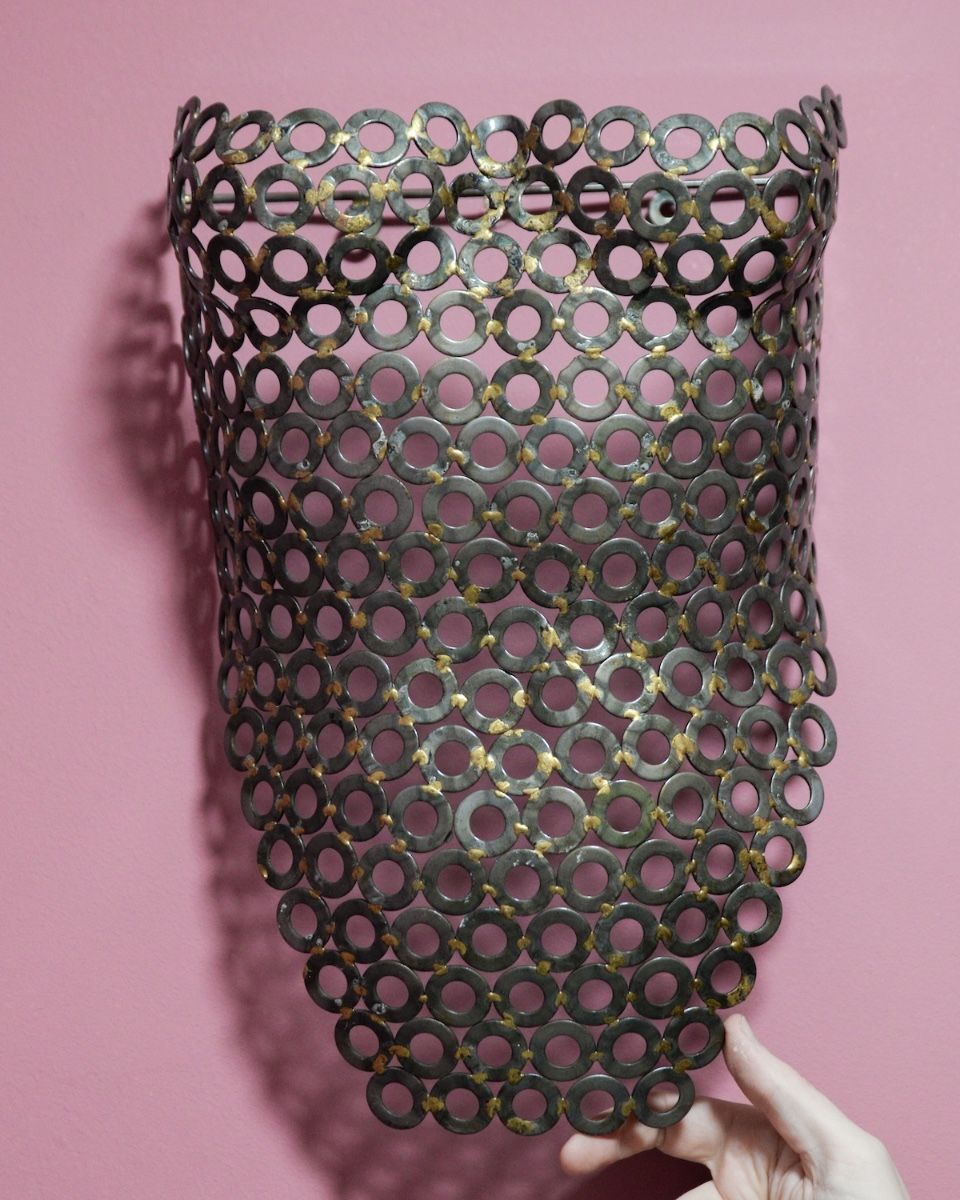 "Vesta" Female Torso Reclaimed Metal Wall Sculpture - 63cm mounted on wall wiht hand in shot for scale