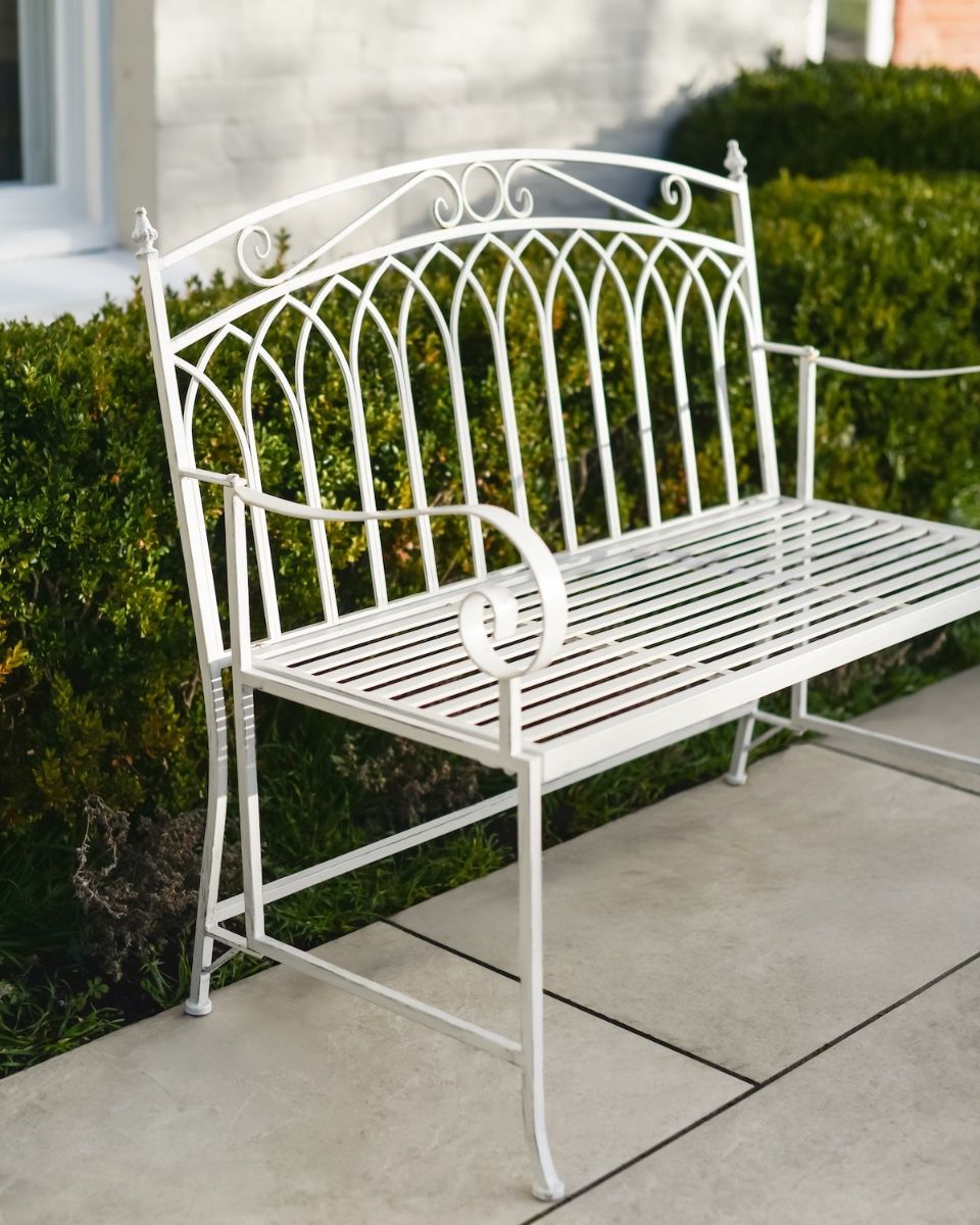 "Vienne" Two Seater Wrought Iron Garden Bench - Cream side view of bench