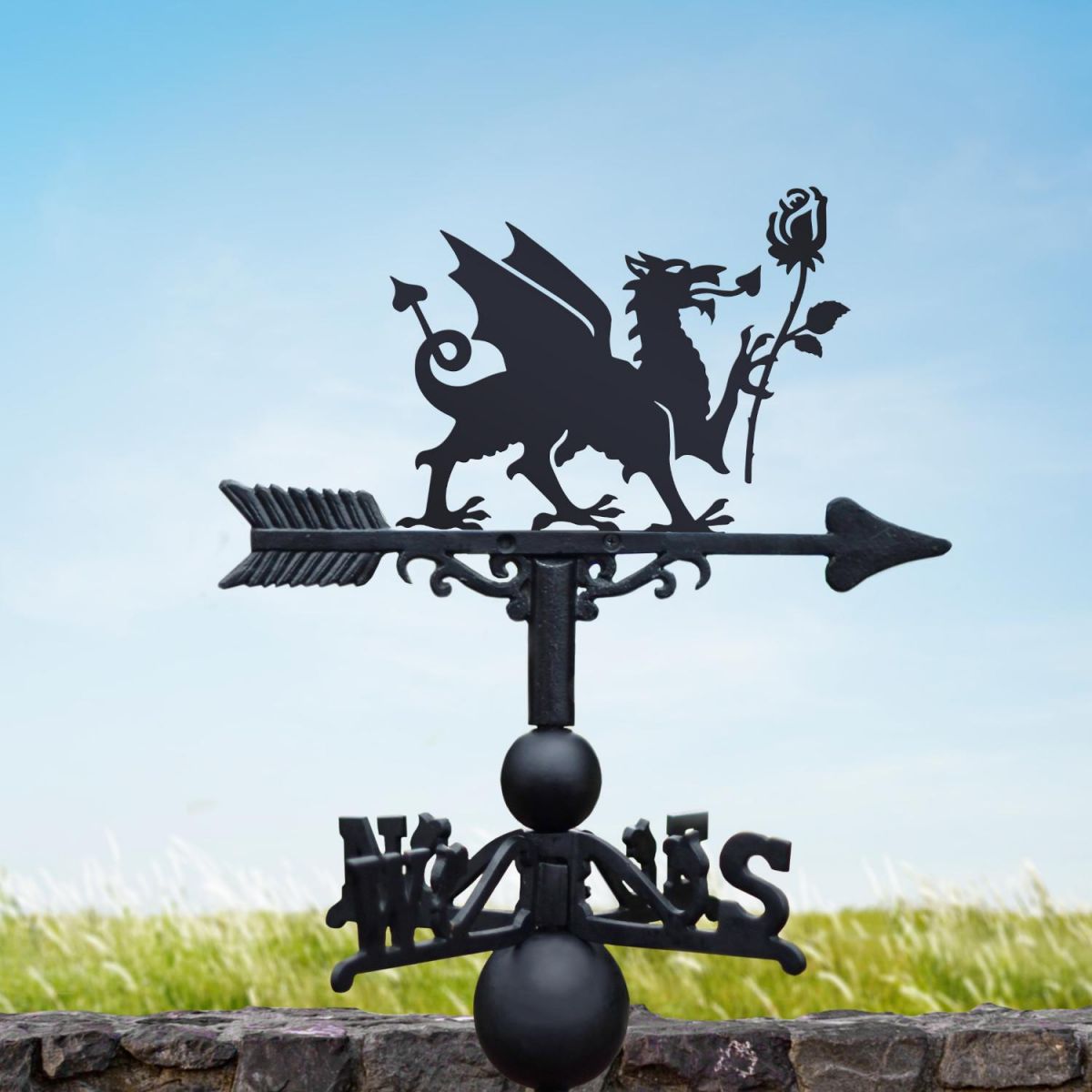 Welsh Dragon & English Rose weathervane on a sunny day