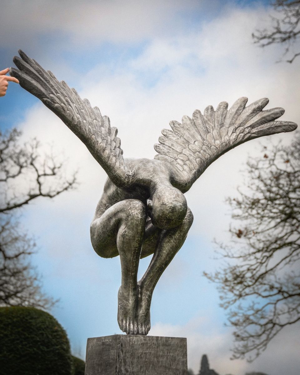 "Winged Solace" Cast Aluminium Angel Garden Sculpture with hand in shot for scale