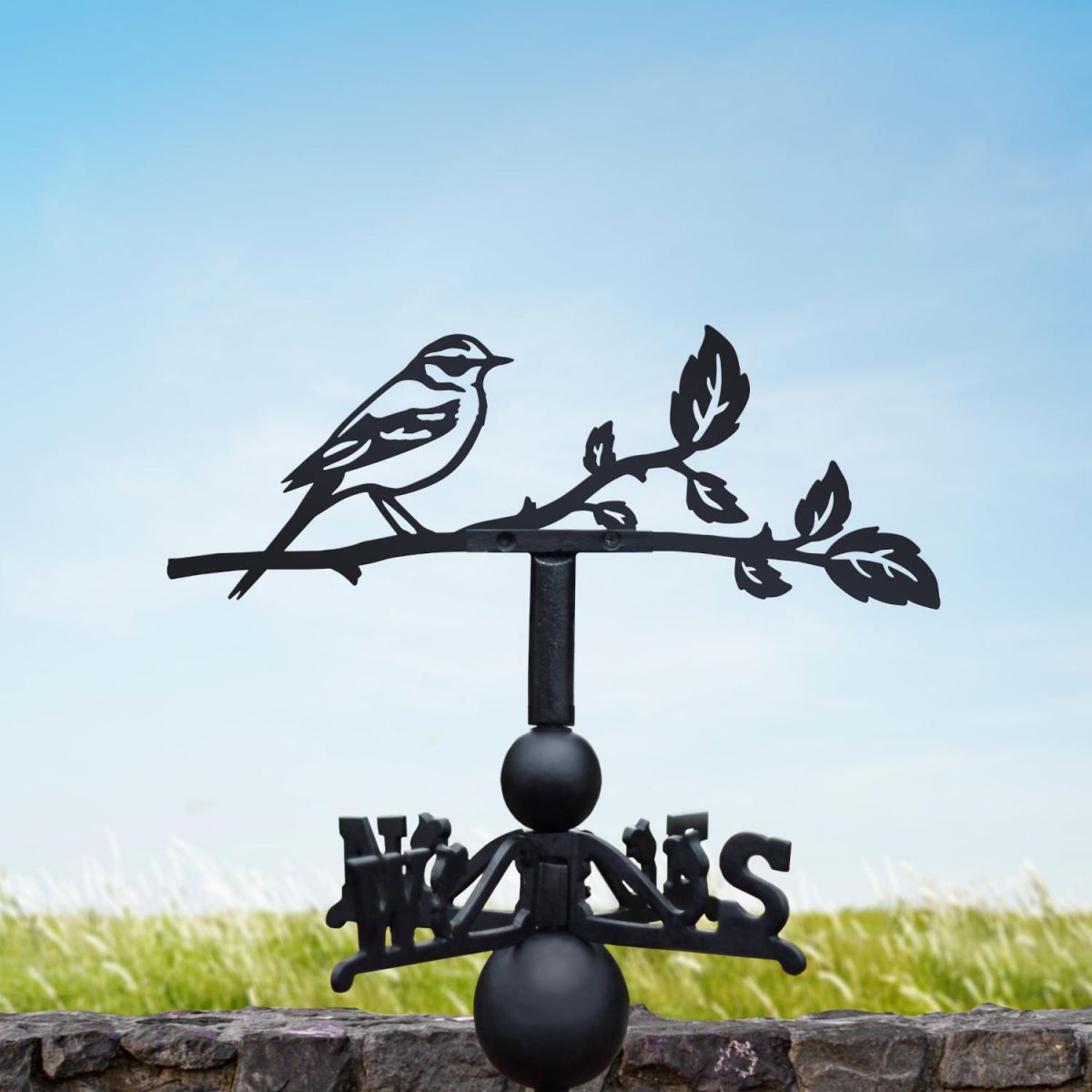 Yellow wagtail weathervane on a summers day