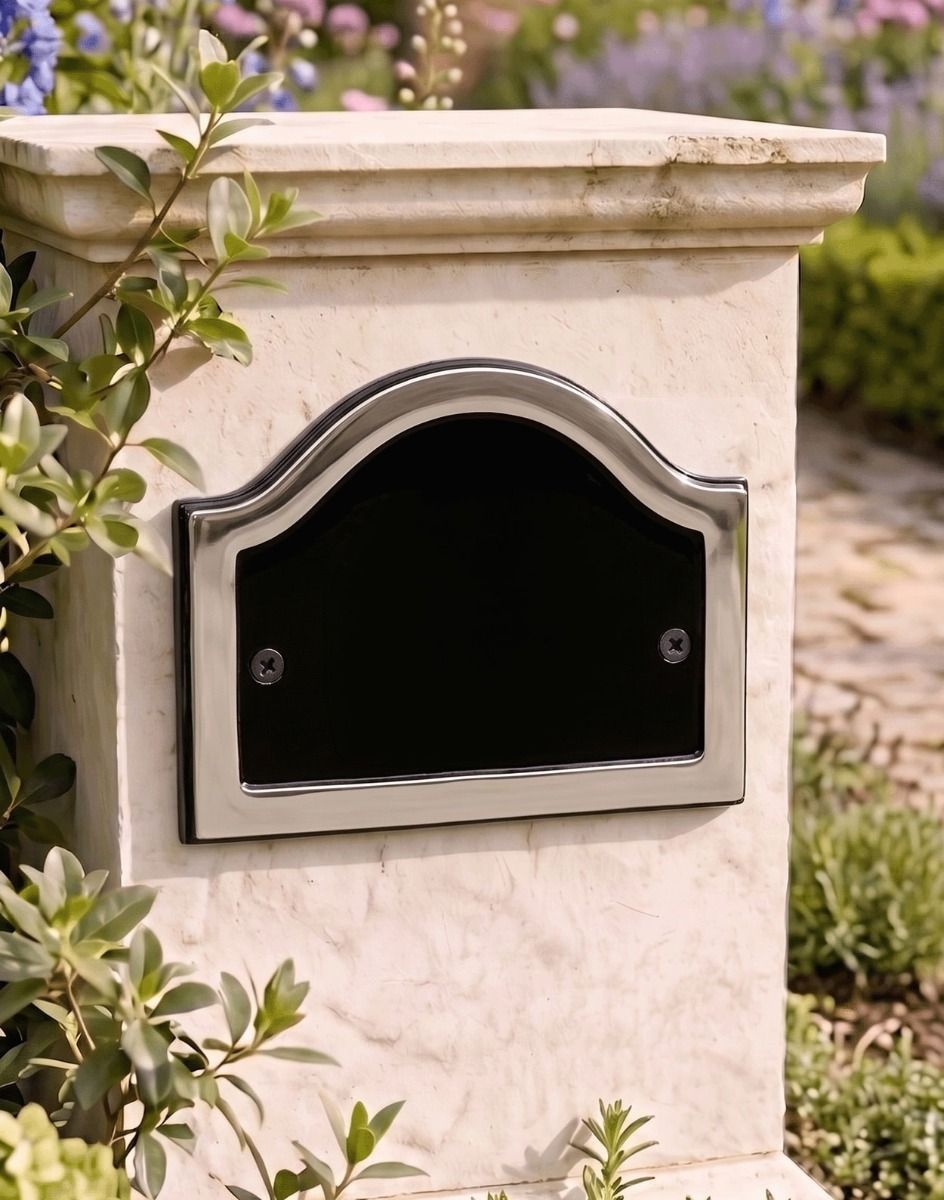 A Blank Arched House Number Plaque in a Black & Chrome Finish Mounted on a Garden Pillar Driveway - Digital Illustration