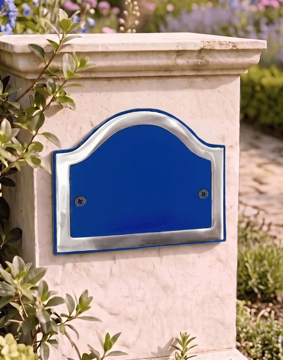 A Blank Arched House Number Plaque in a Blue & Bright Chrome Finish Mounted on a Entrance Driveway Pillar - Digital Illustration